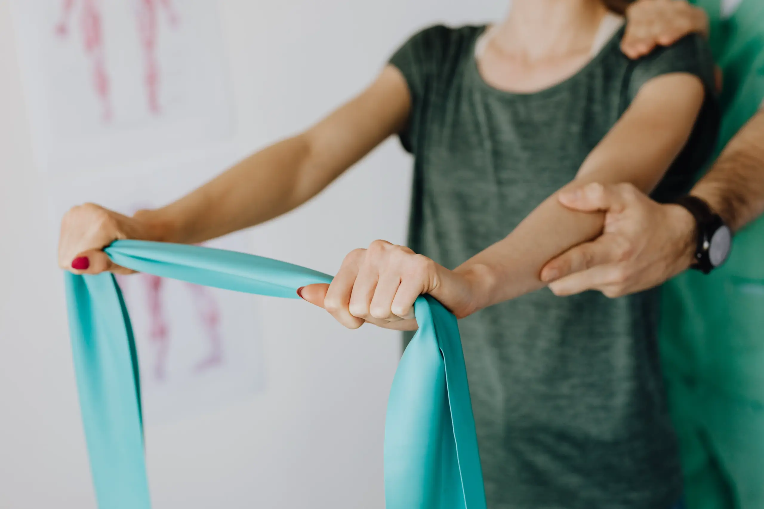 Person using a theraband for physical therapy.