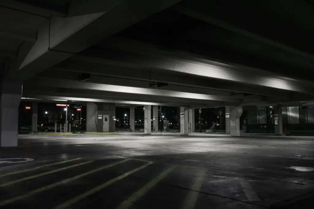 An empty, dark, parking lot.