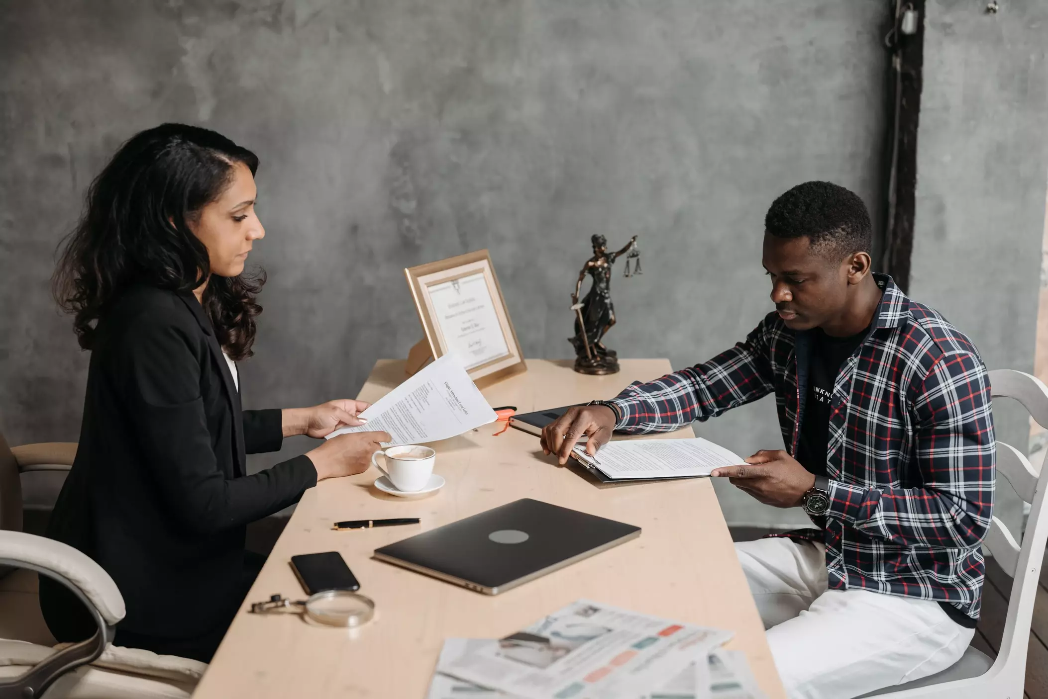 An attorney speaking with her client.
