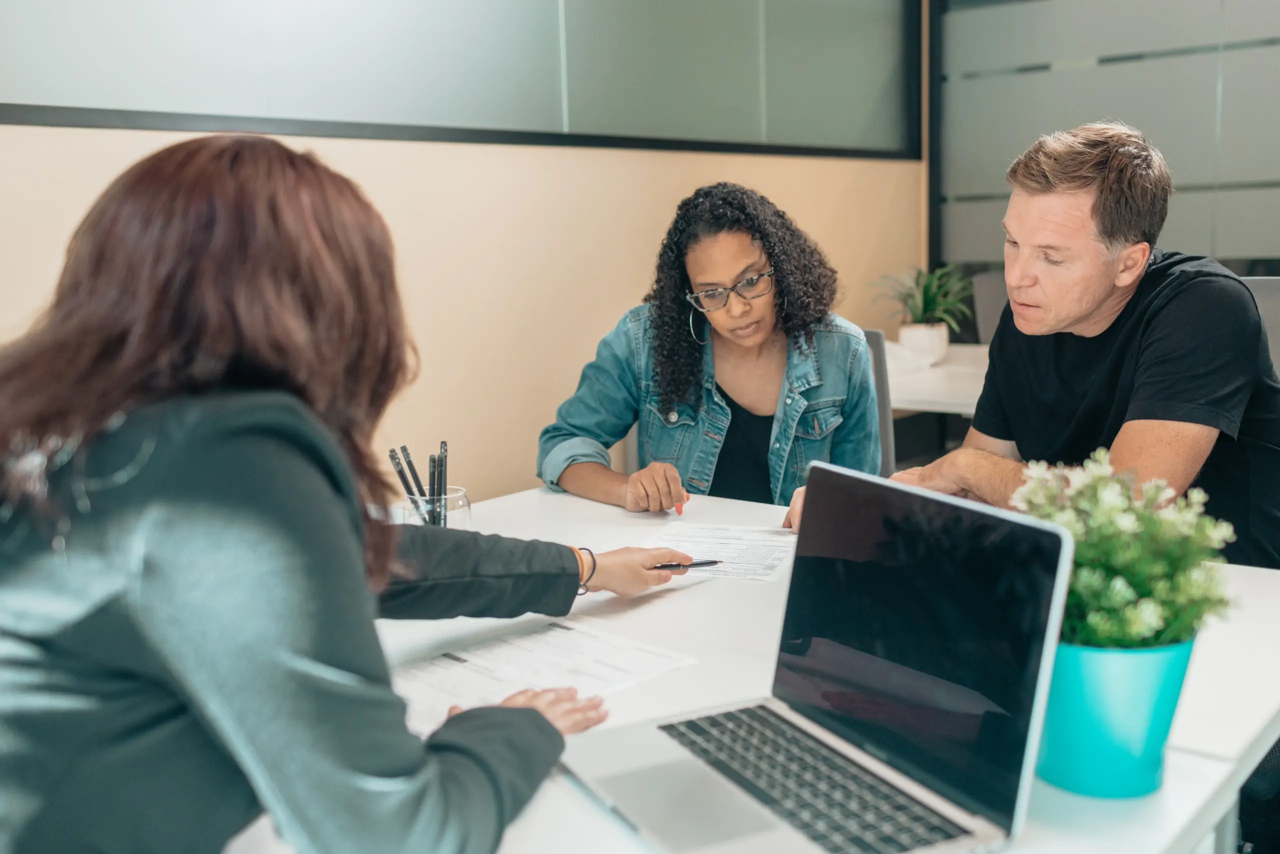 An attorney speaking with her clients.