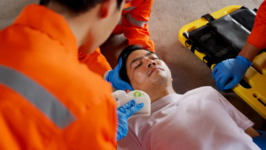 An injured worker on a stretcher.