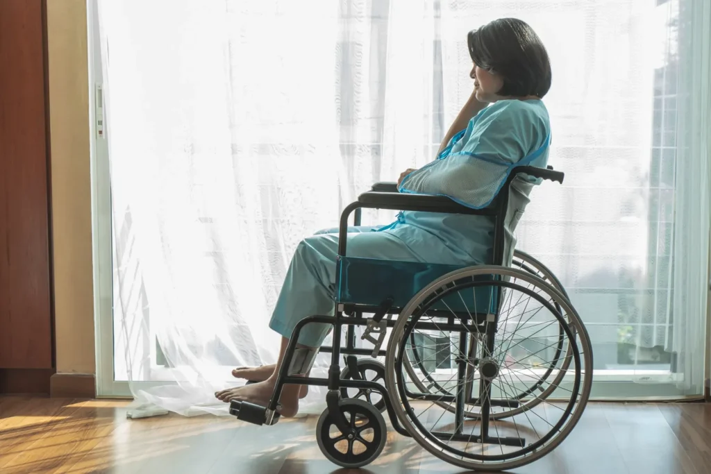 A woman sitting in a wheelchair.